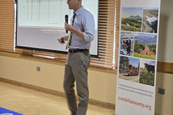 Dr. Perry, Ph.D., Professor of Economic CMU presenting