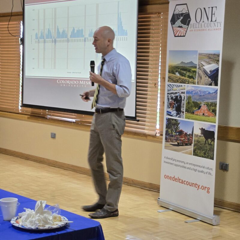 Dr. Perry, Ph.D., Professor of Economic CMU presenting