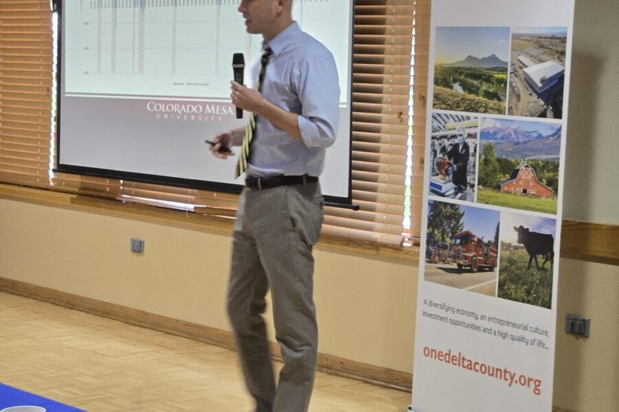 Dr. Perry, Ph.D., Professor of Economic CMU presenting