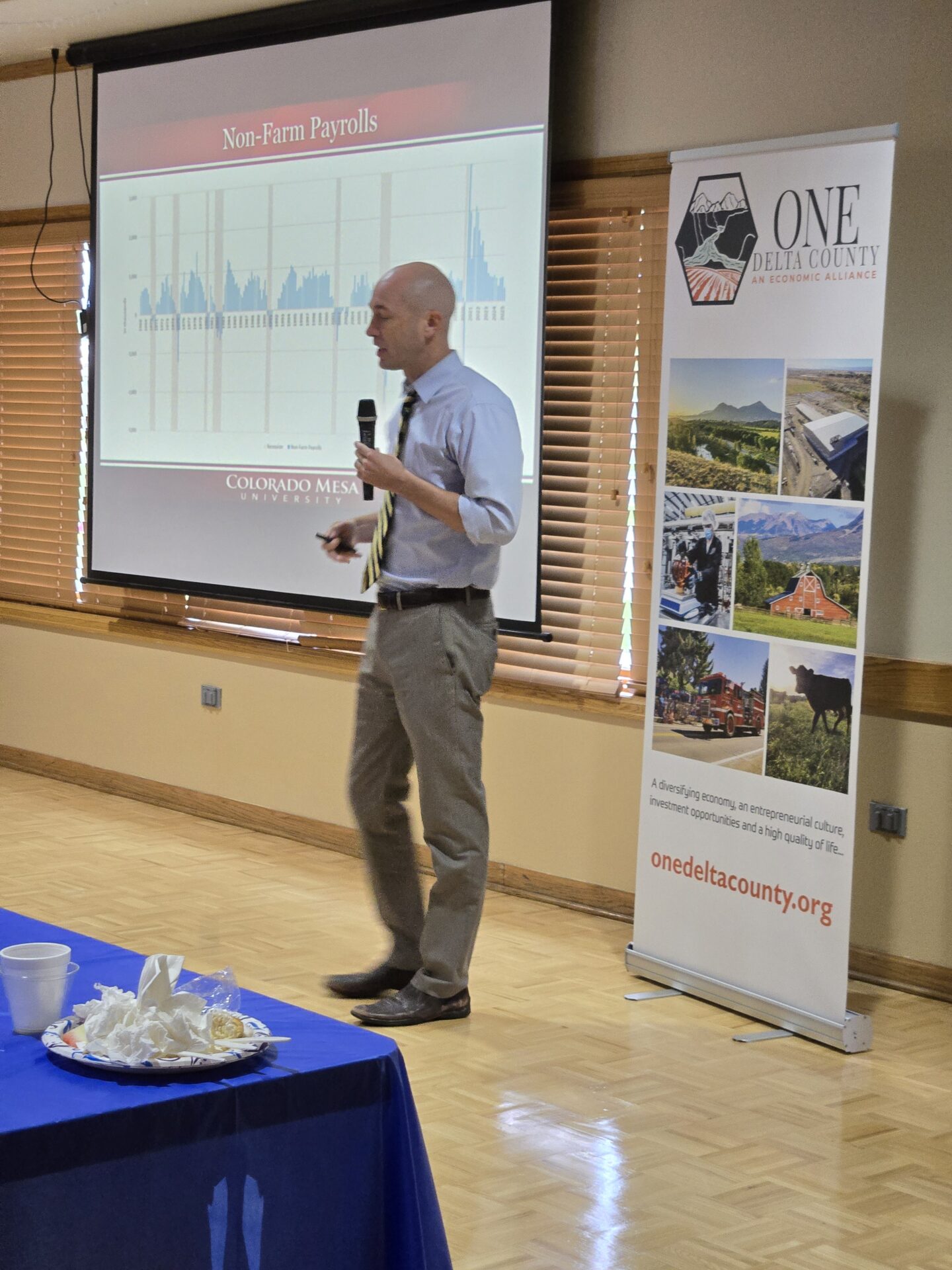 Dr. Perry, Ph.D., Professor of Economic CMU presenting